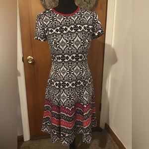 Unique design black and white with hints of red dress